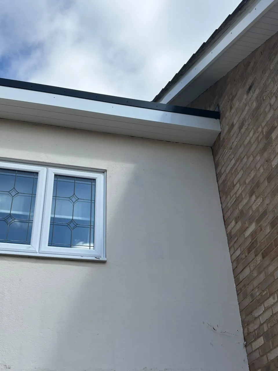 White uPVC soffit and fascia fitted around roof edge
