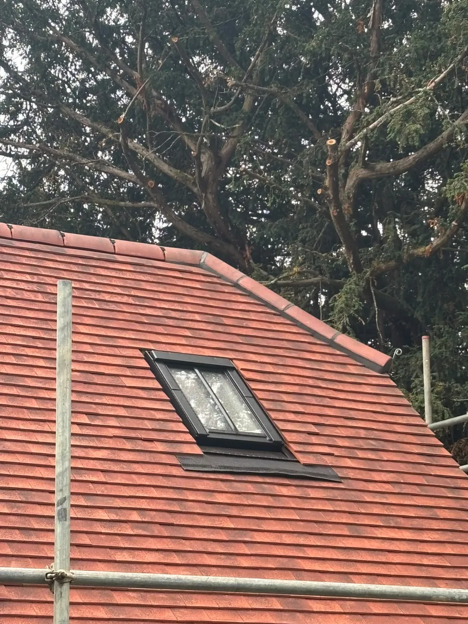 New plain tile re-roof with roof window and tiled ridge