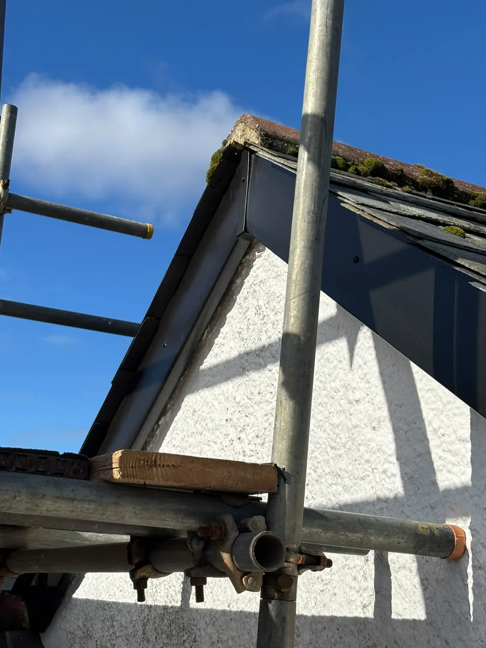 Dark uPVC bargeboard detail on a gable roof