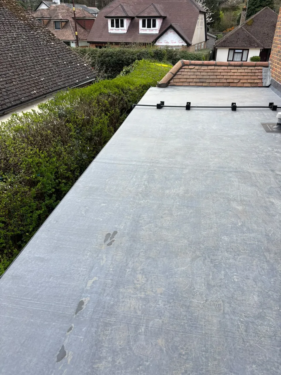Large EPDM rubber flat roof with brick parapet, Aldershot area