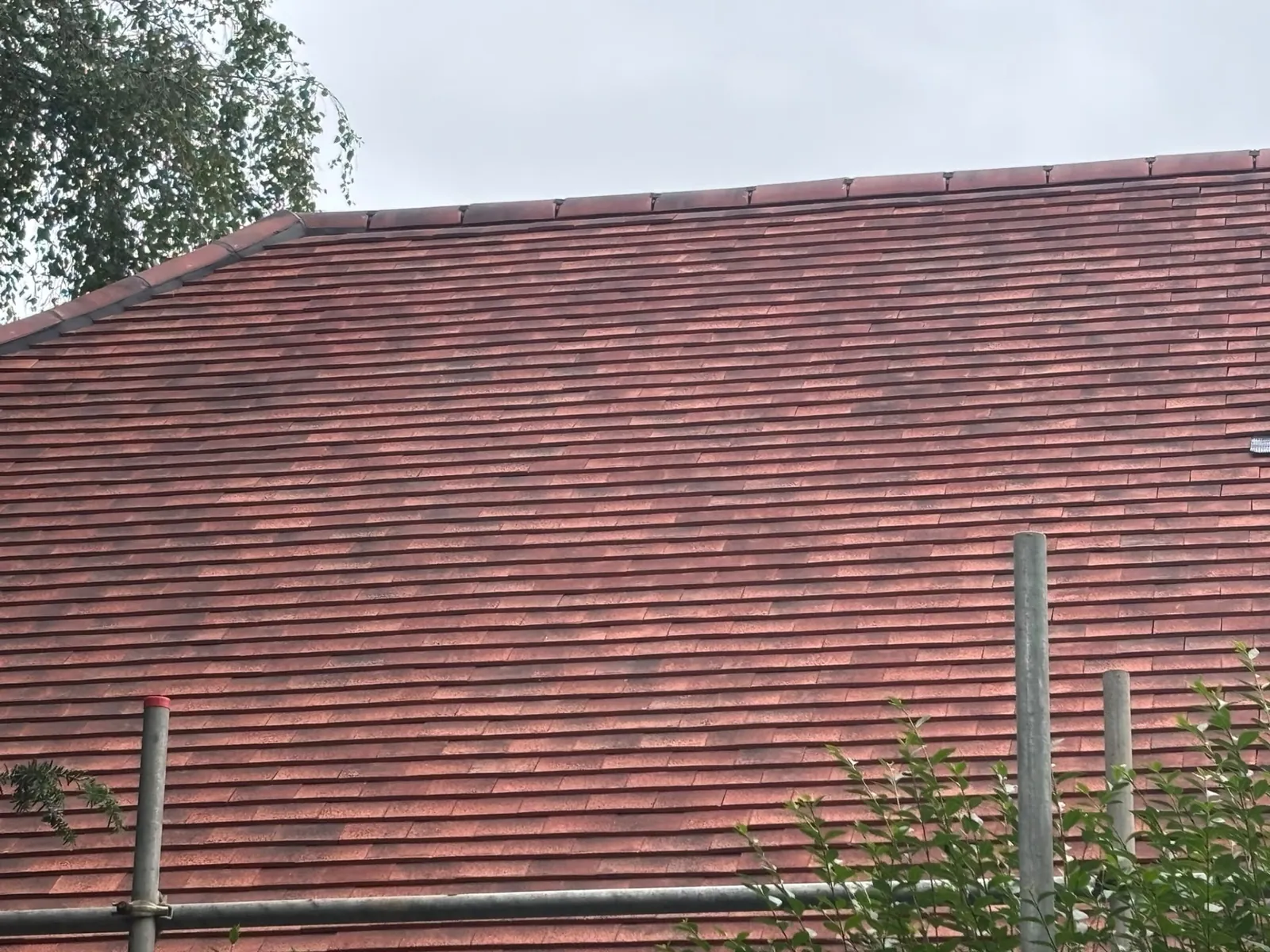 Completed red clay tile re-roof viewed from scaffolding, Aldershot area