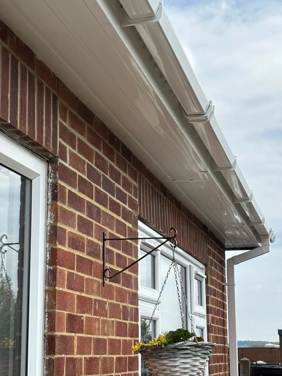 White uPVC soffits along the eaves of a brick house