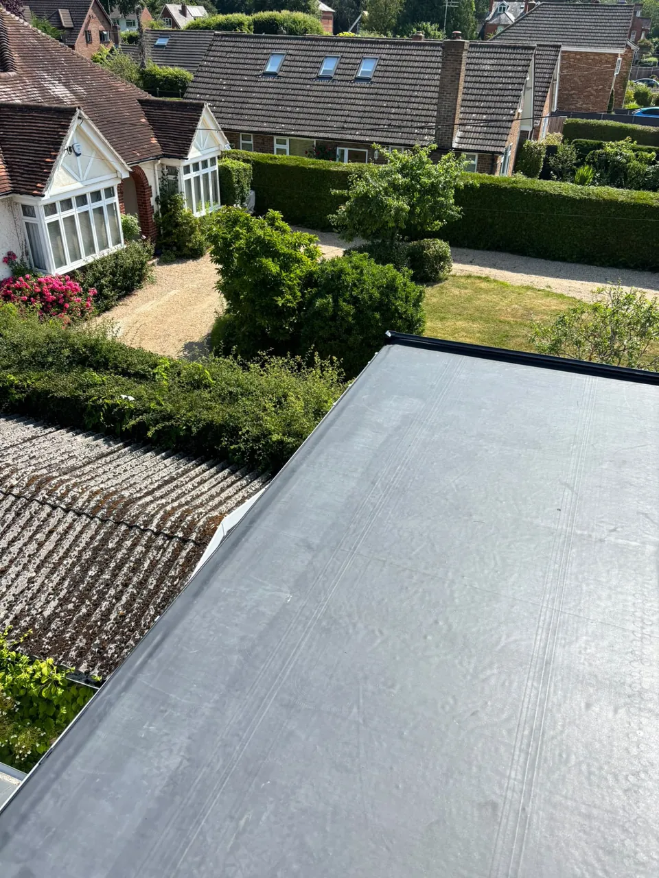 EPDM rubber flat roof on an extension beside a garden
