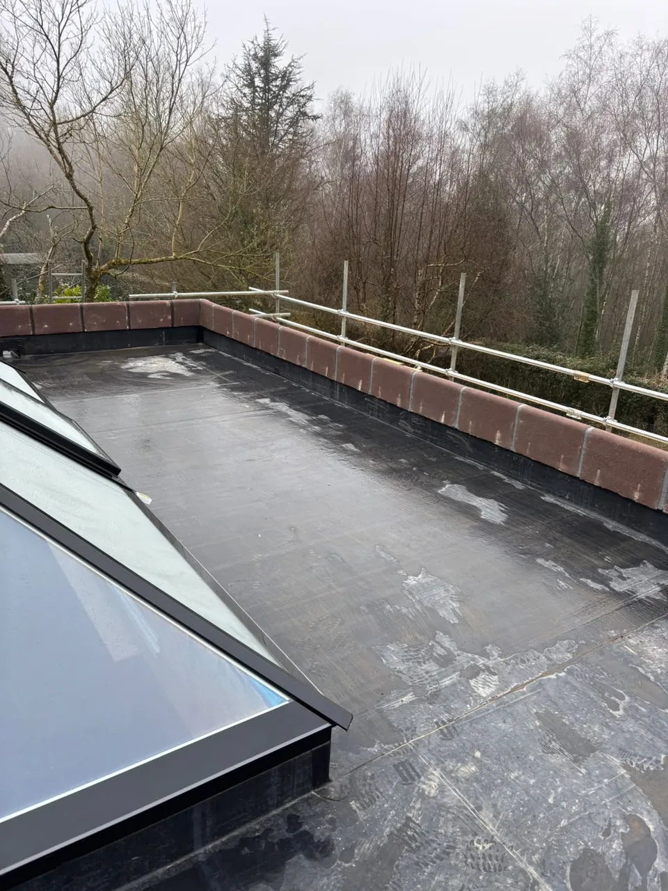 EPDM flat roof with large rooflight and parapet